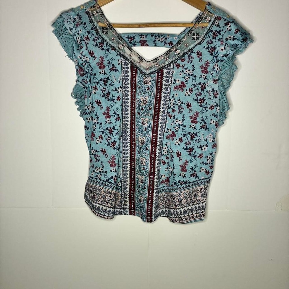 No Boundaries blue floral blouse with red and black accents